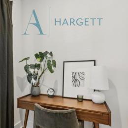 a modern desk with a logo overlay